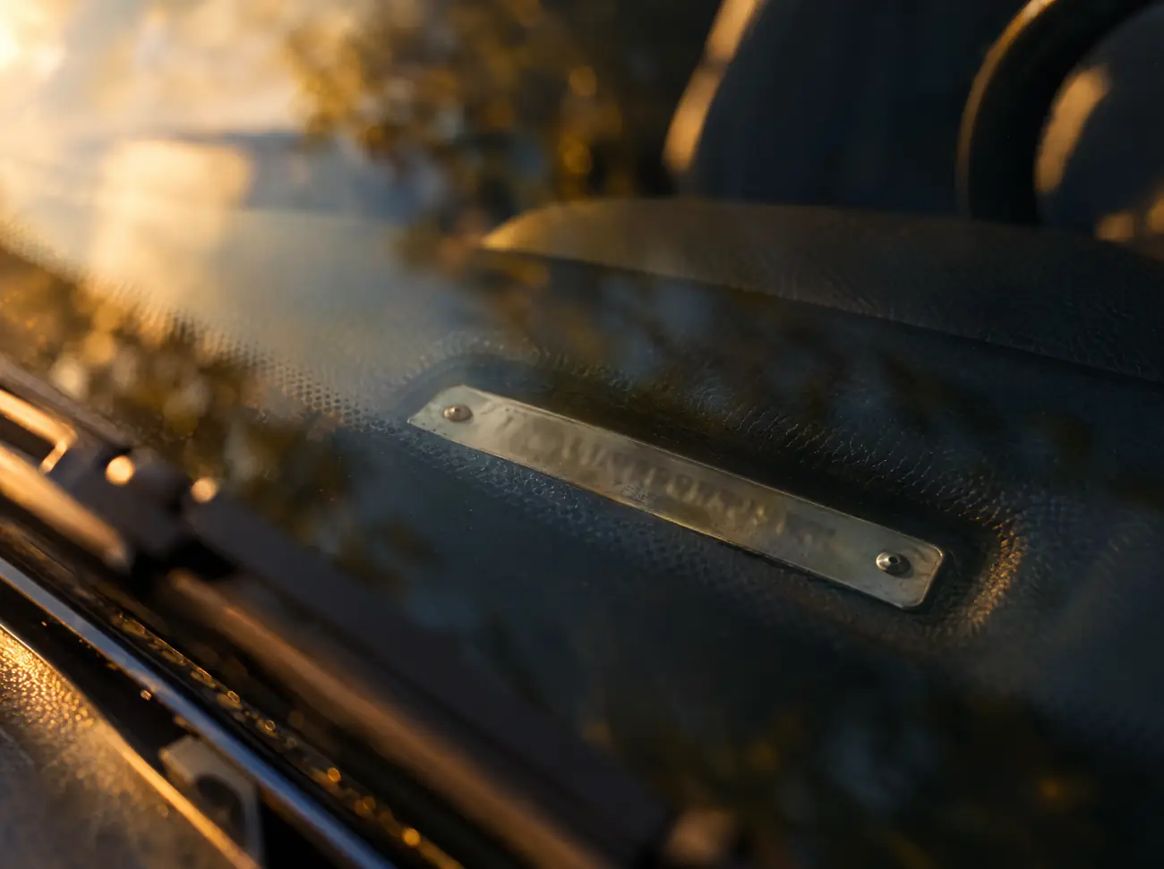 The VIN plate on a car's dashboard